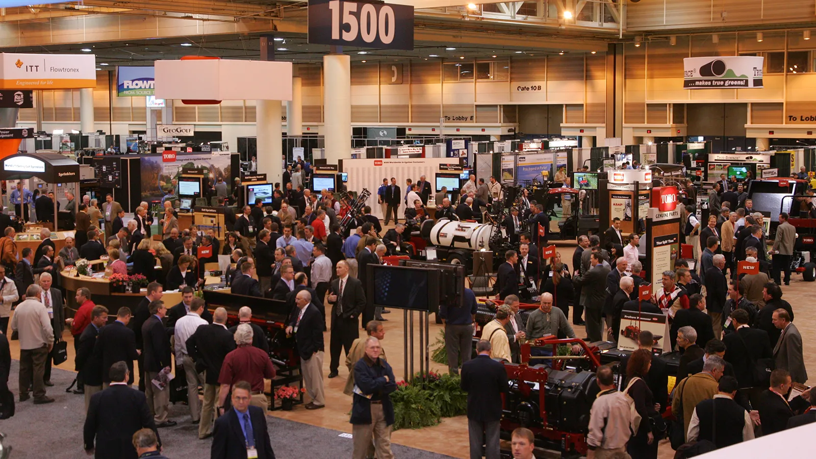 Aerial view of the trade show floor with numbered exhibitor booth signage